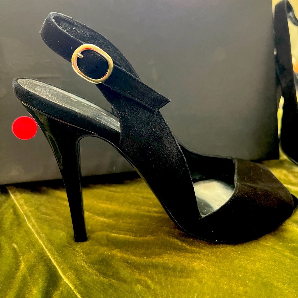 Black suede sling back peep toe heel.